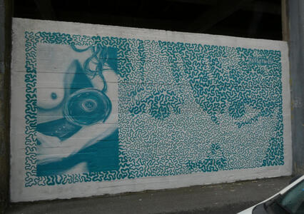 face drawn with continuous squiggly line