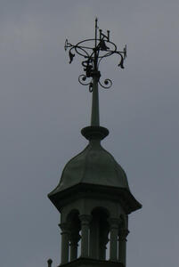 Weather vane with letters for four cardinal directions