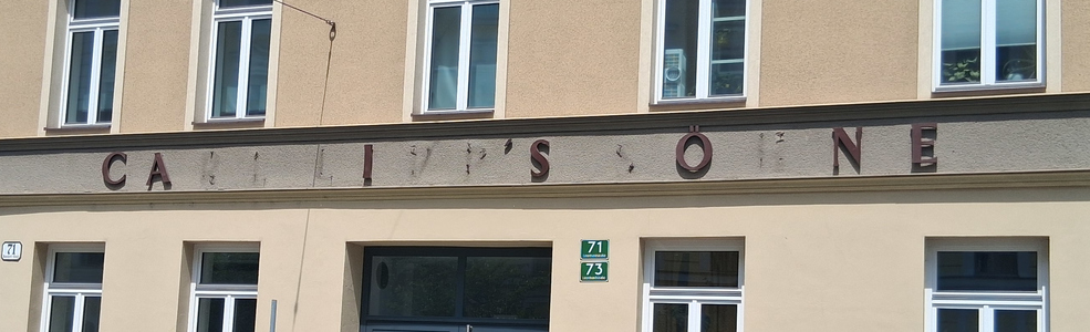 storefront sign with many missing letters