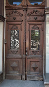 wooden doors with glass windows in them