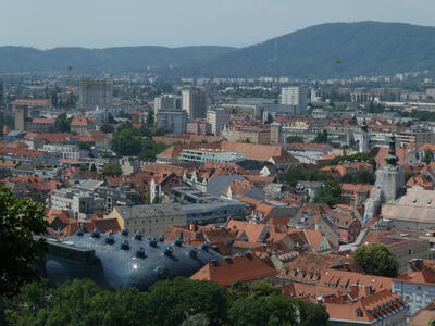View of Graz, with Kunsthaus in the foreground.