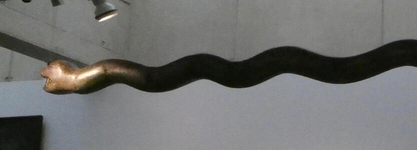 sculpture with snakelike head