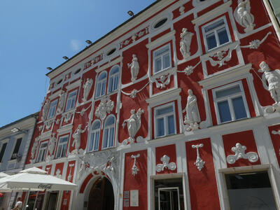 white carvings on red building