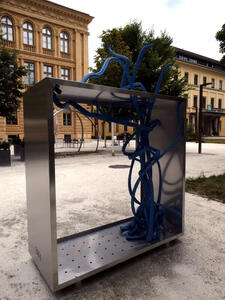 sculpture with tangle of blue cables