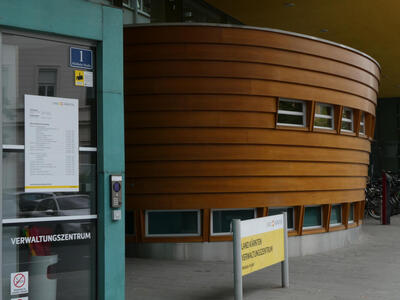 building with curved wooden portion