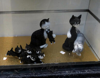 small sculptures of cats and kittens