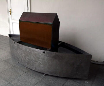 house in a tub of water