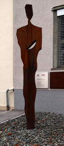 abstract metal sculpture of standing man