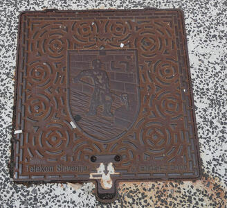 worker pouring molten metal into mold
