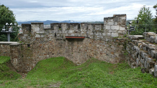 old stone wall on castle grounds