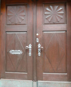 Wooden door with handles painted white
