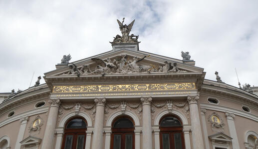 Gold leaf decoration above windows at opera house