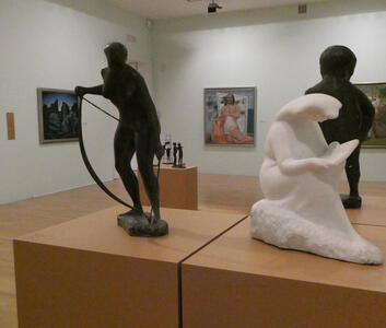 Sculptures in foreground, paintings in background