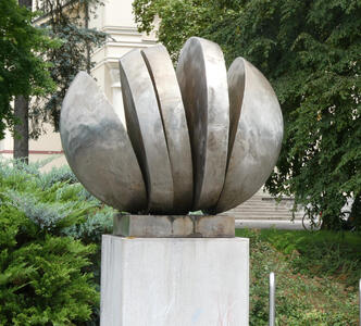 Sculpture of a sphere sliced like a loaf of bread