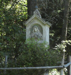 Part of old chapel with bust of Mary