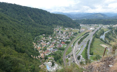 View of city at left, highway in middle, and Mur river at right