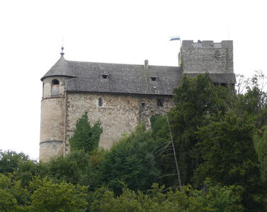 Gösting Ruins, with a section that is still standing and looks a bit like a castle