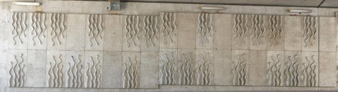 Tunnel with wavy snake-like decoration on the concrete tiles