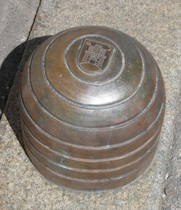 Short traffic pylon with coat of arms of Zagreb embossed on top.