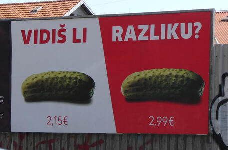 Vidiš li razliku? Showing a pickle at left costing 2,15€ and an identical pickle on the right costing 2,99€.