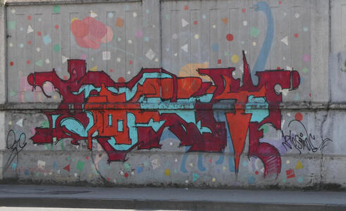 Abstract design in dark purple, turquoise, and red.