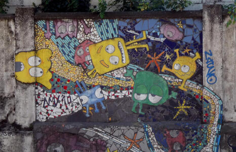 Cartoonish aliens in yellow, red, blue, and green