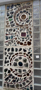 Wall with many colored stones.