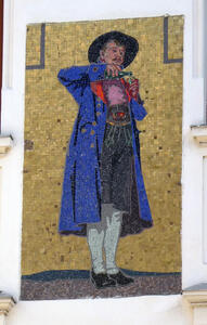 Mosaic of man in blue jacket and black hat, pouring a glass of wine.
