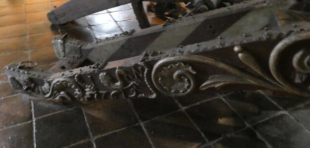 Metal scrollwork at base of cannon