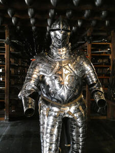 Suit of armor with intricate metalwork decoration