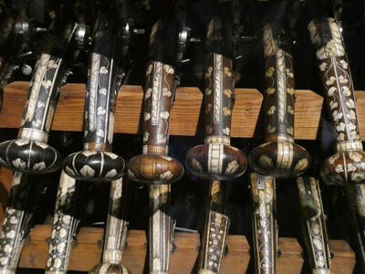 Decorated pistol handles with vine design