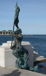 Bronze sculpture of a soldier carrying a flag