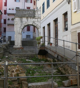 Old Roman arch attached to a modern house.