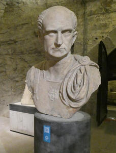 Bust of a Roman high official. The official has male pattern baldness.