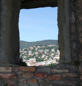 View of Trieste through an opening in the battlements