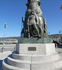 Statue of soldier Erminio Bassa at base of column