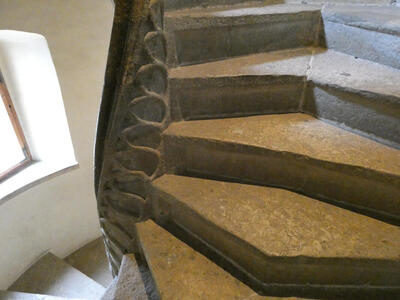 View of stairway spiraling at left bottom; at top right, it diverges again.