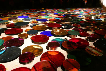 Multicolored circular mirrors on floor