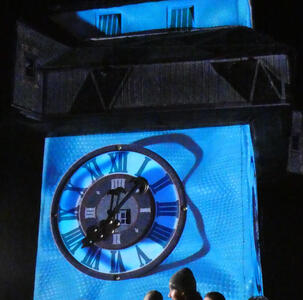 Blue projection on Uhrturm with curved irregular shape in background