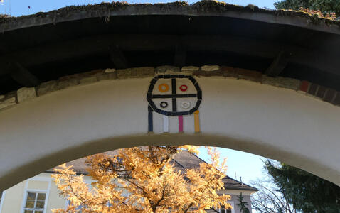 Arch with native American religious symbol