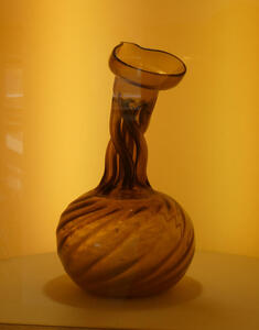 Vase whose neck consists of intertwined glass tubes