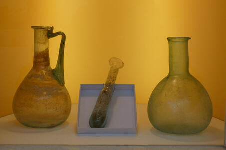 Glass pitcher, pestle, and flask (looks like an Erlenmeyer flask) from 1st century CE