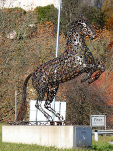 Sculpture made of horseshoes; it is a horse rearing up on its hind legs.