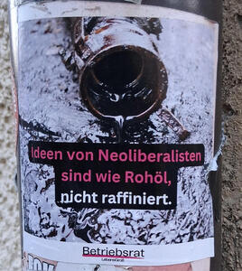 Picture of crude oil pouring from a pipe. Text: Ideen von Neloliberalisten sind wie Rohöl, nicht raffiniert. Subtitle: Betriebsrat LebensGroß