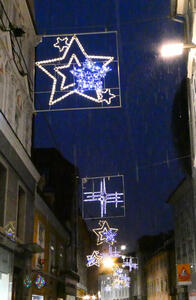 Christmas decorations in form of stars, attached to a building