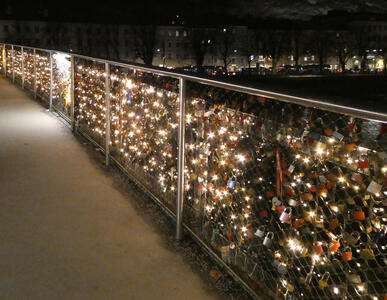 Bridge railing with christmas lights strung throughout