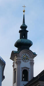 Church steeple above clock tower.