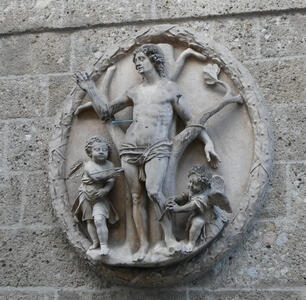 Carving of saint pierced by arrows, attended by cherubim.