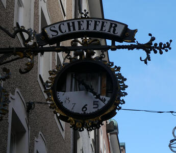 Other side of clock; the upper half of the face is missing.