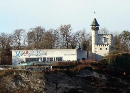 At left, modern art museum; at right, old castle-like building